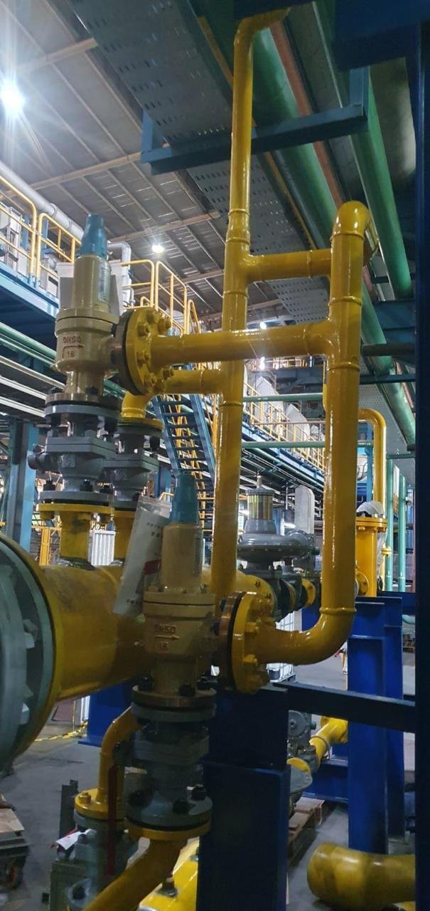 Gas piping along an industrial structure