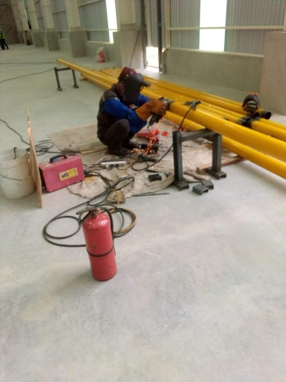 Installing a gas pipeline on a factory floor