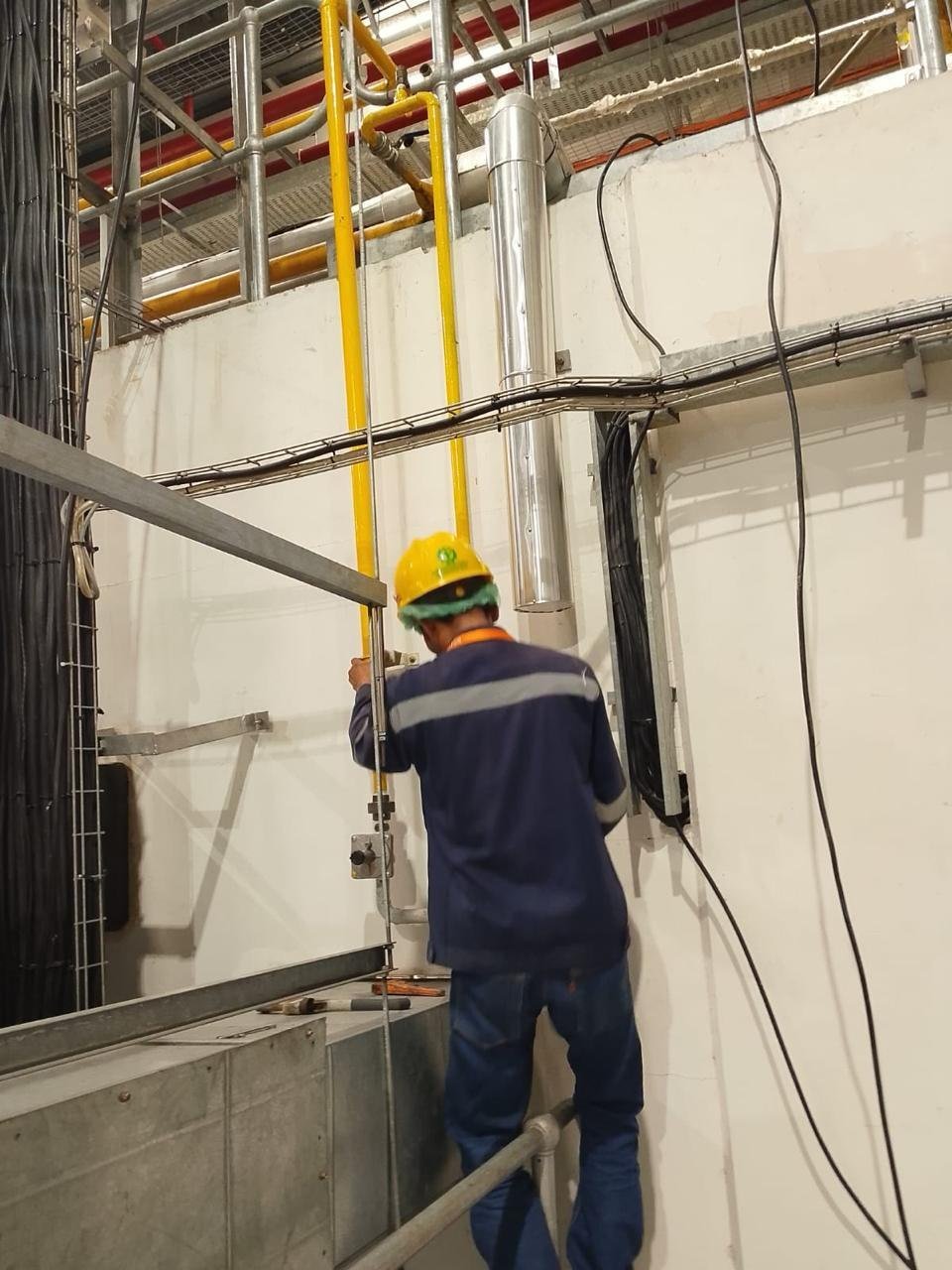 Technician installing a vertical gas line