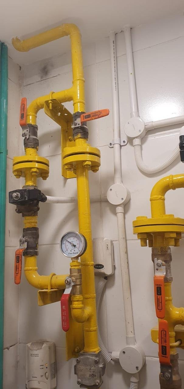 Gas pressure regulators and gauges on a wall