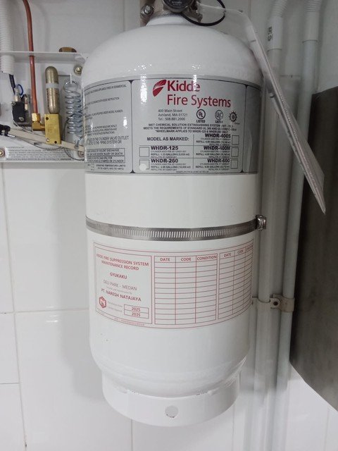 Kidde WHDR cylinder installed on a tiled kitchen wall