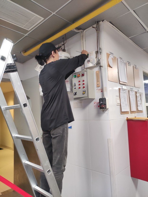 Engineer checking a control panel