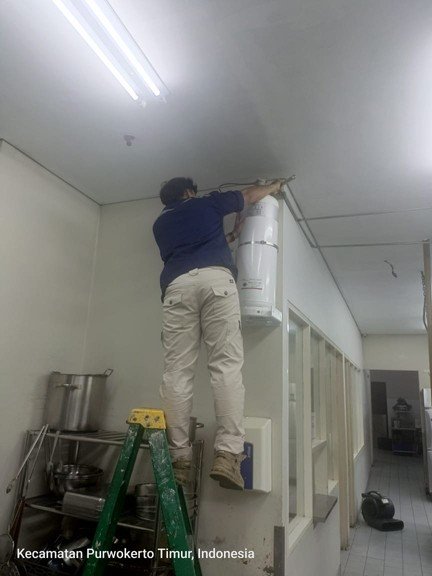 Technician servicing a fire suppression cylinder
